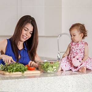 mother cooking with baby