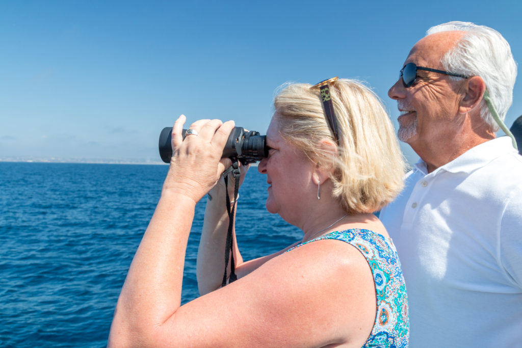 Jim and Shelley whale watching with binoculars